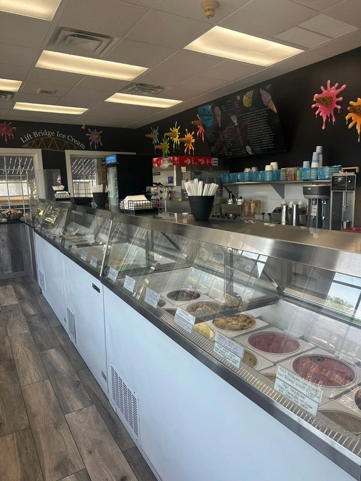 The long glass dipping case and counter inside the shop